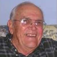 A Man Smiling For The Camera