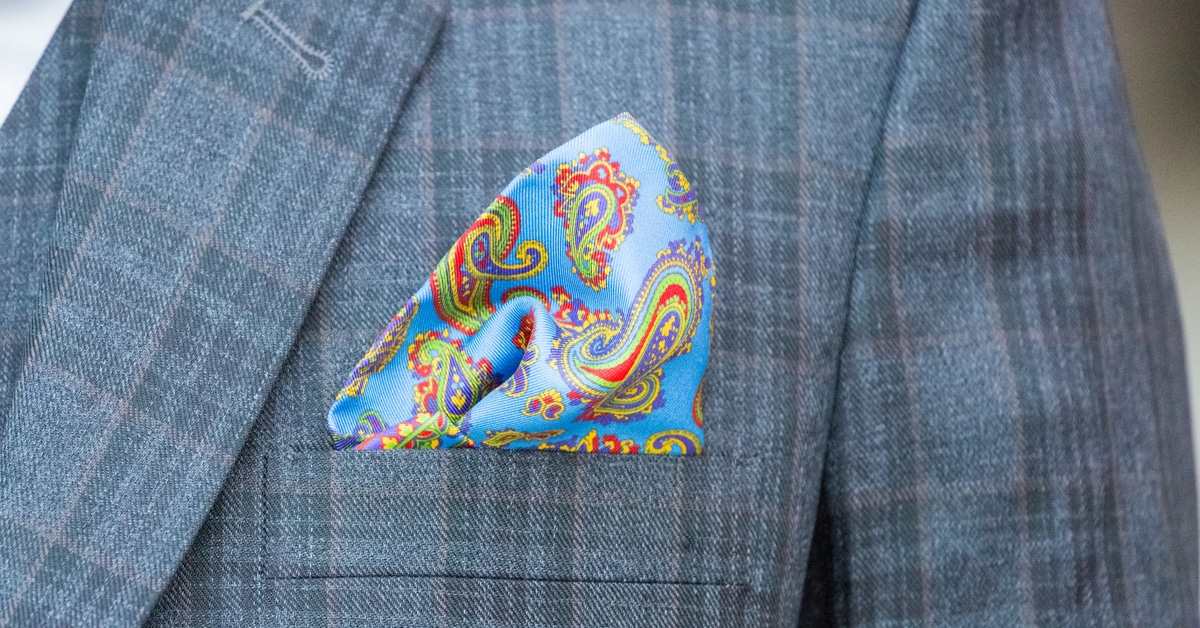 A Close Up Of A Man In A Blue Shirt