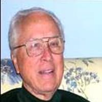 A Man Smiling For The Camera