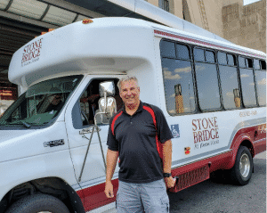 a man standing in front of a truck