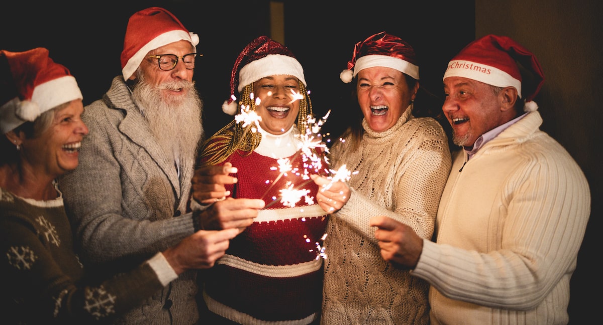 A Group Of People Holding Wine Glasses